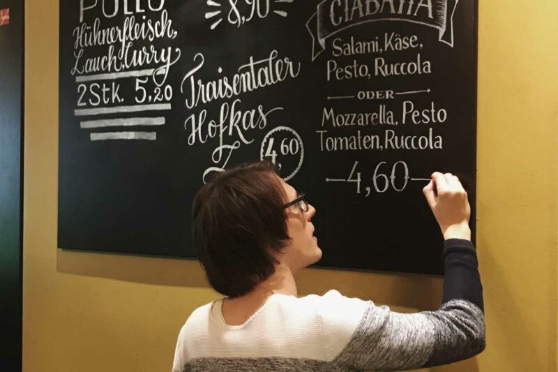 Adding the final touch to the chalkboard lettering