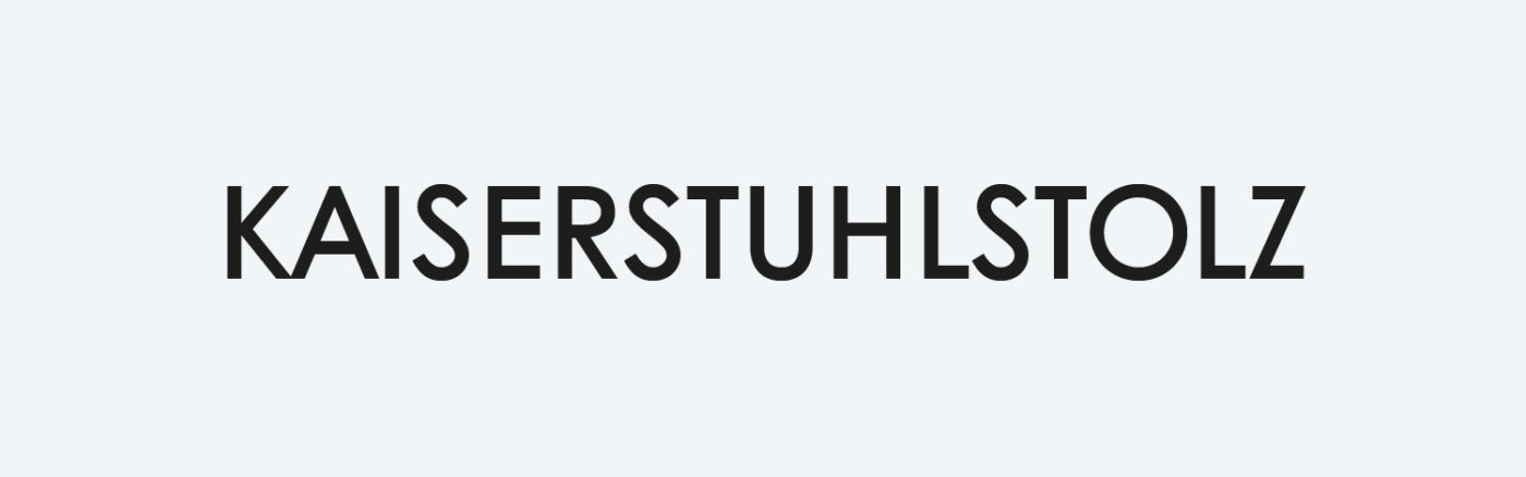 All caps Kaiserstuhlstolz logotype untreated with tight spacing
