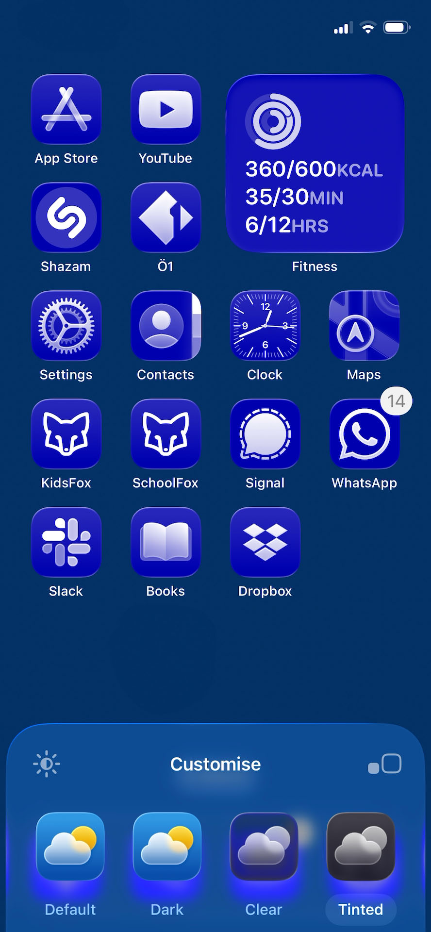 iOS 26 home screen features a rich, deep blue "Tinted" glass style. The app icons, widgets, and even the customization interface adopt a cohesive midnight blue tone with soft gradients and white accents for glyphs and text.