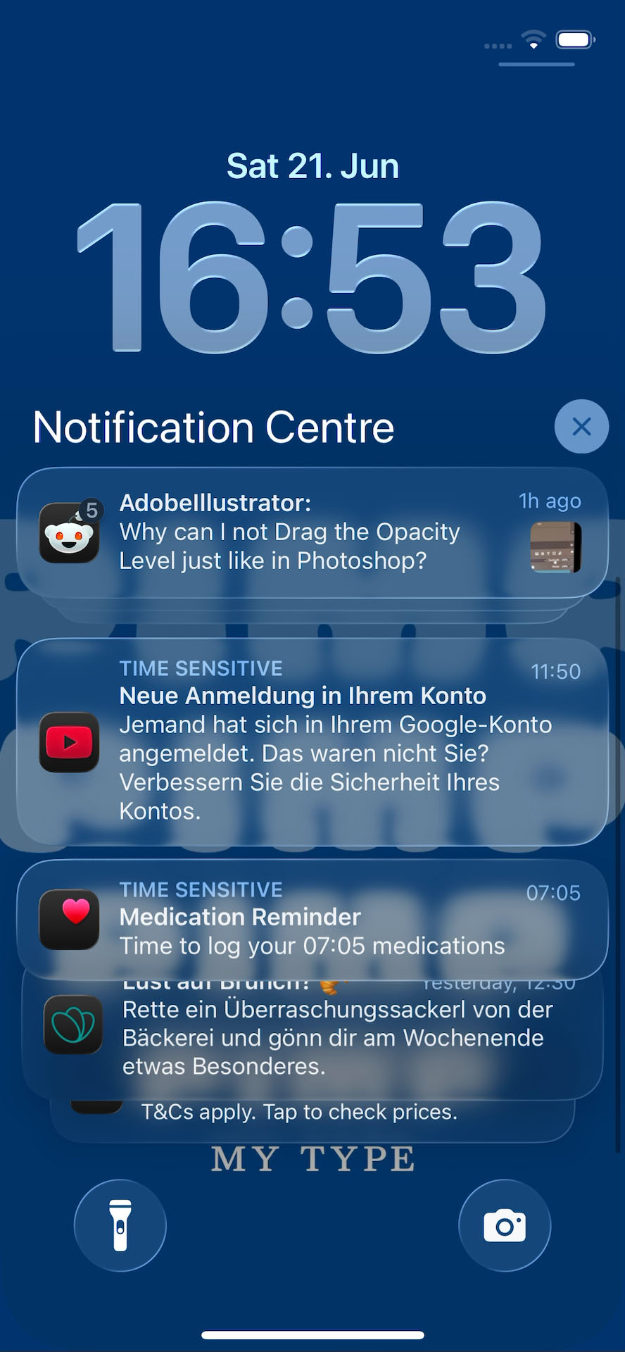 An iPhone lock screen running iOS 26 shows a large clock and multiple notifications stacked. The wallpaper background is blue with text on it. Some of the notifications are partially obscured and hard to read due to transparency effects.